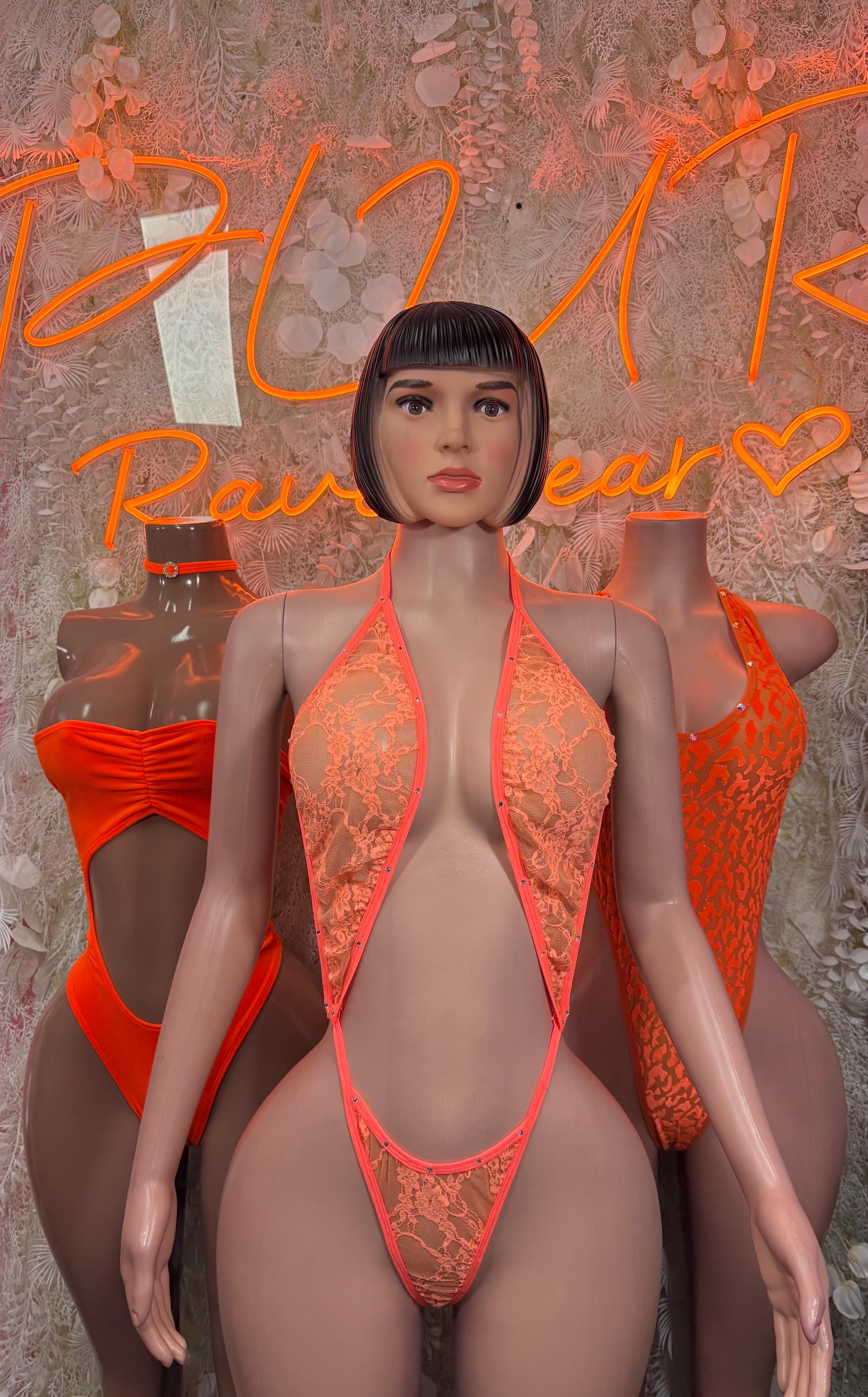 Orange lace slingshot bodysuit with deep V-front and thin straps
