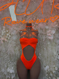 Orange one-piece bodysuit with halter neckline and draped front cutout