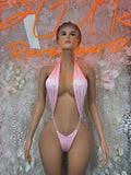 Pink halter one-piece bodysuit with plunging front and thin string straps