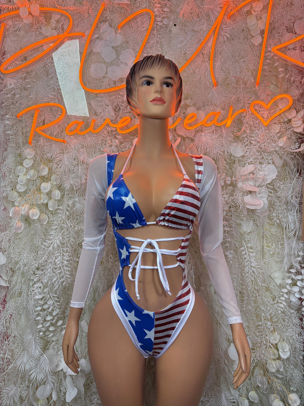 Patriotic stars-and-stripes bodysuit with white tie straps and long sheer sleeves