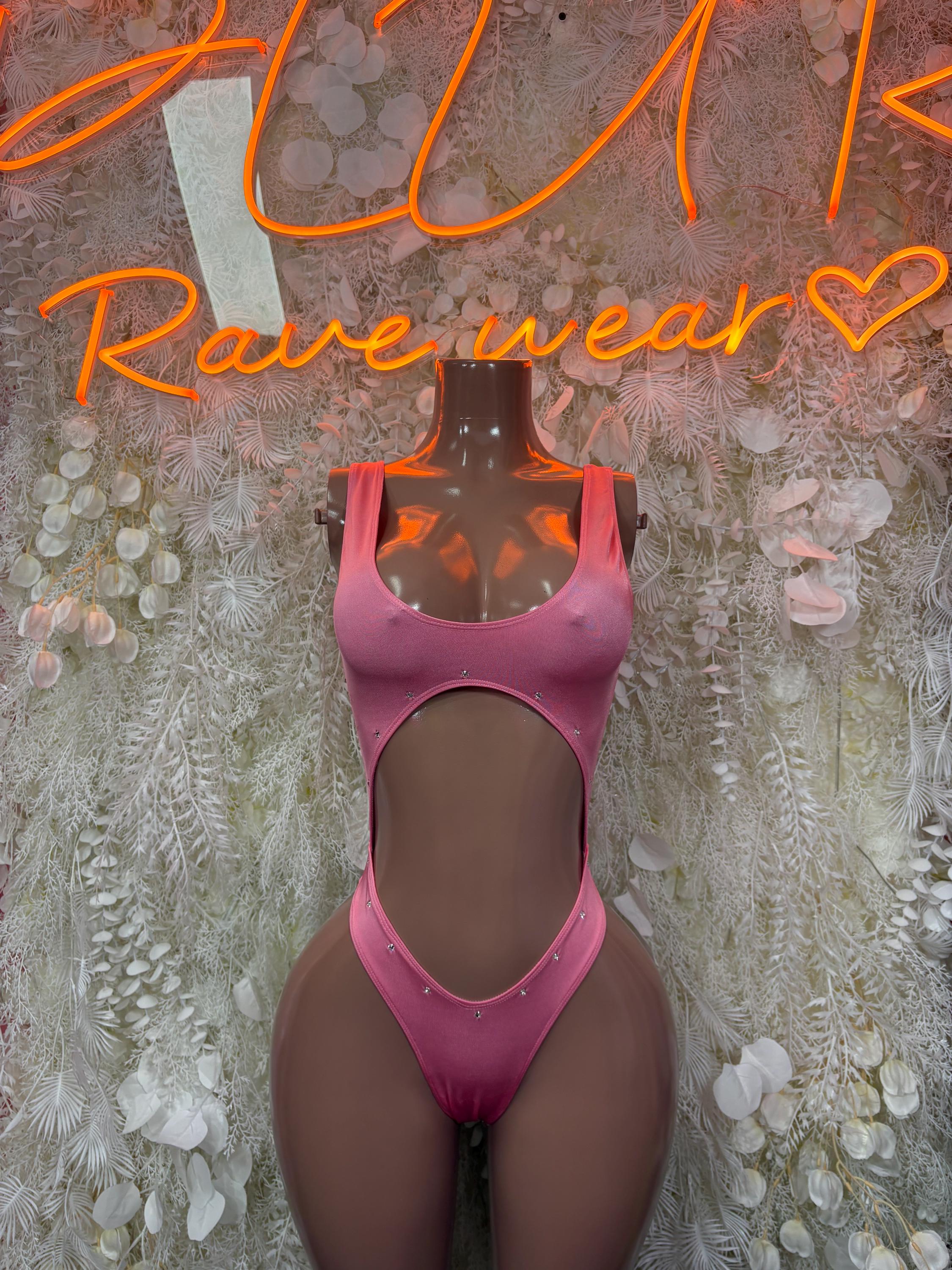 Pink one-piece bodysuit with scoop neckline and high-cut leg openings.