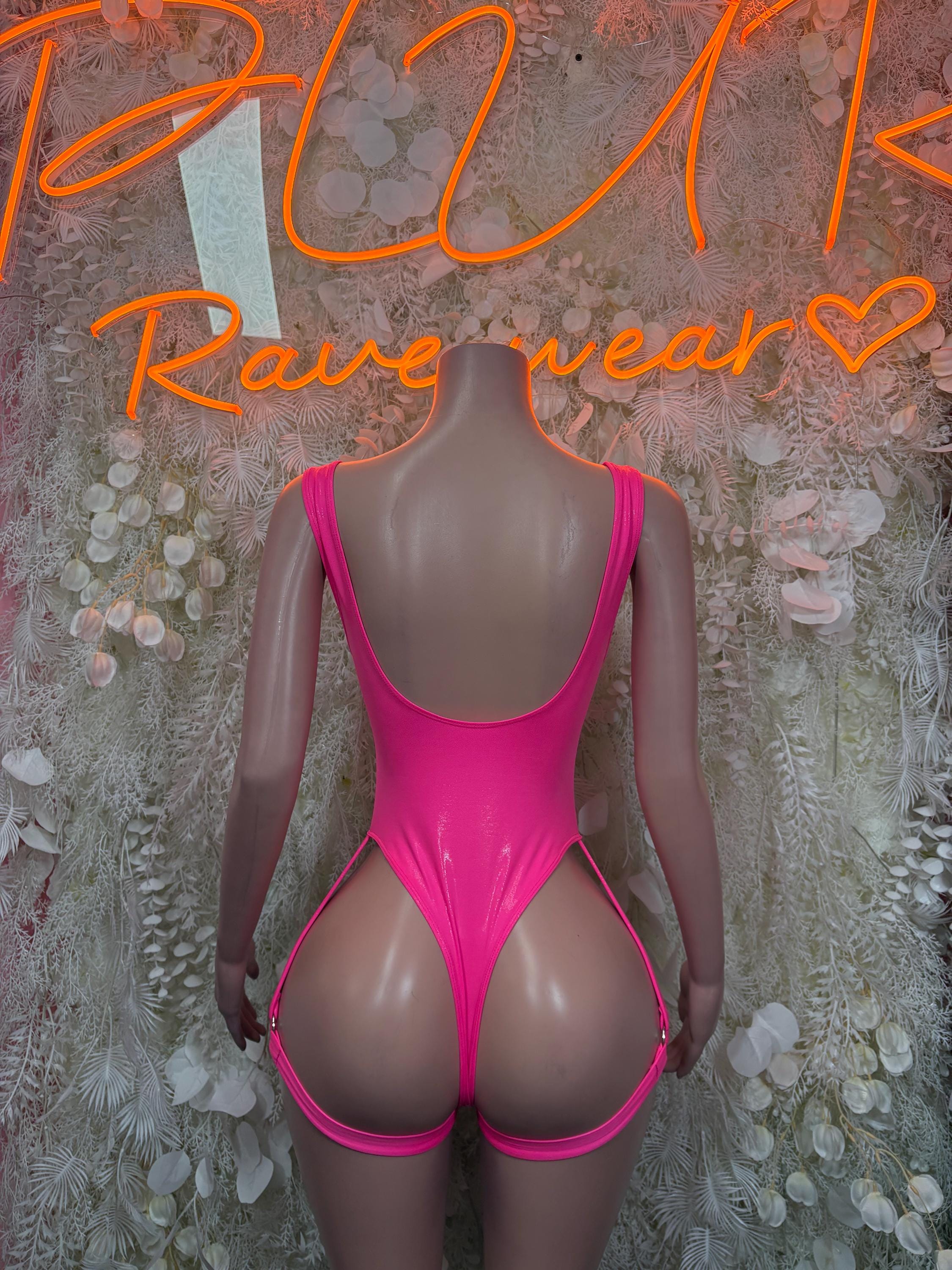 Pink one-piece bodysuit back view with narrow straps and high-cut legs