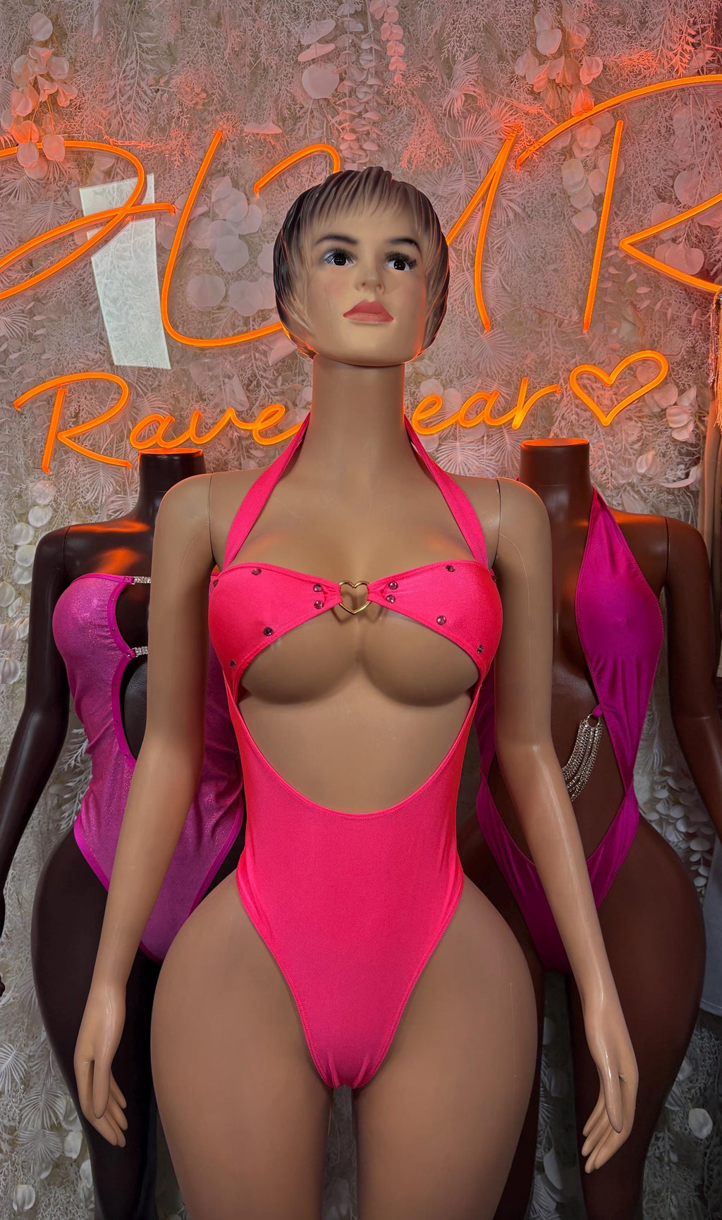 Hot pink one-piece bodysuit with underwired bra cups and center cutout front