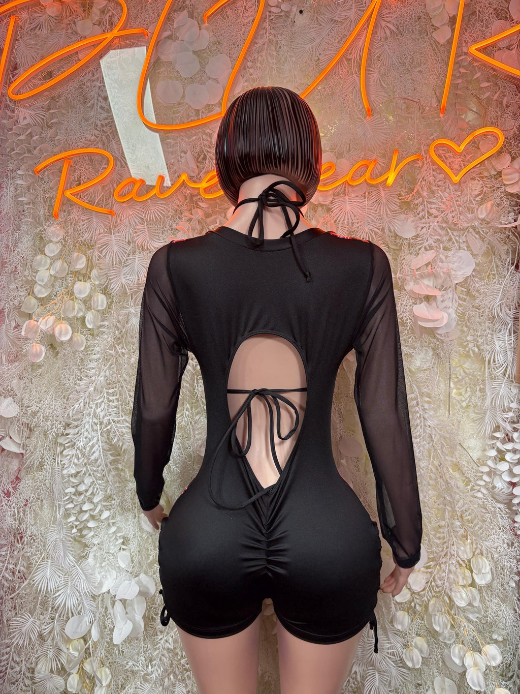 Black sheer long-sleeve bodysuit with open back and crisscross lace tie