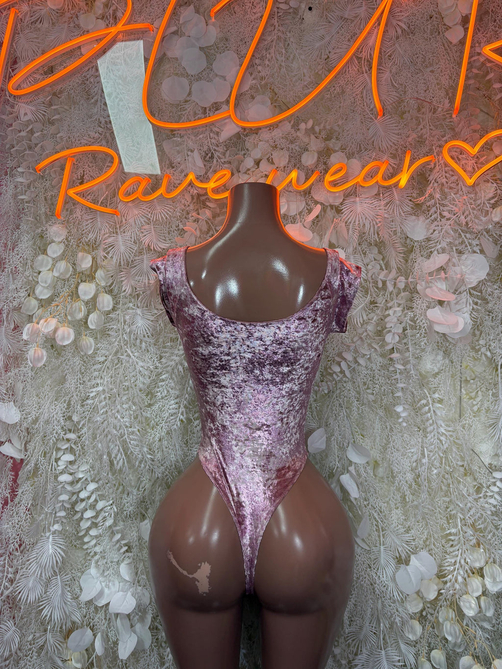 Purple velvet one-piece bodysuit with scoop neckline and high-cut legs
