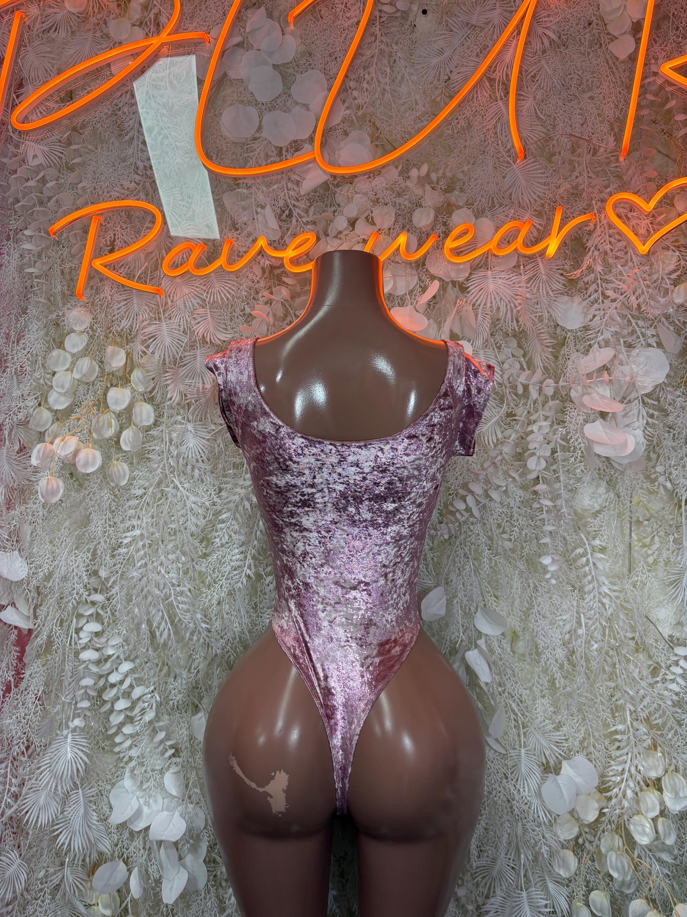 Purple velvet one-piece bodysuit with scoop neckline and high-cut legs