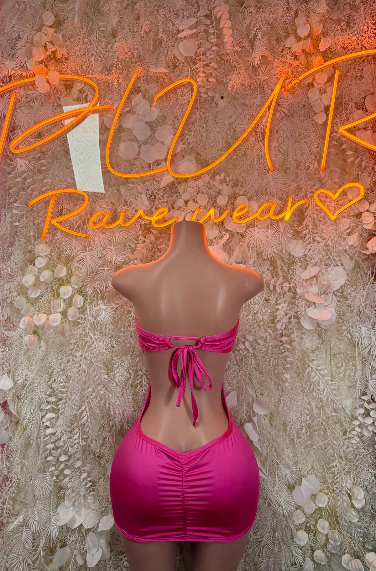 Hot pink ruched mini dress with bow back ties and open back
