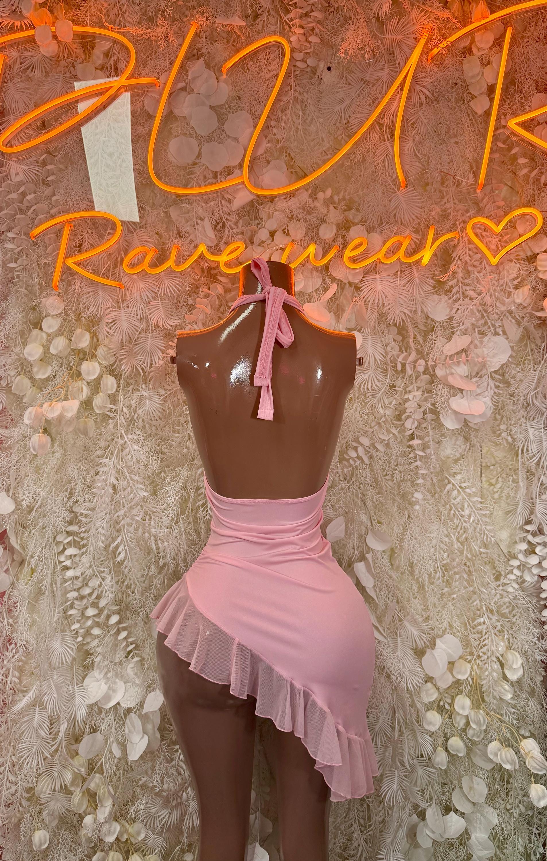 Light pink halter mini dress with neck tie, V-neck cutout and ruffle skirt