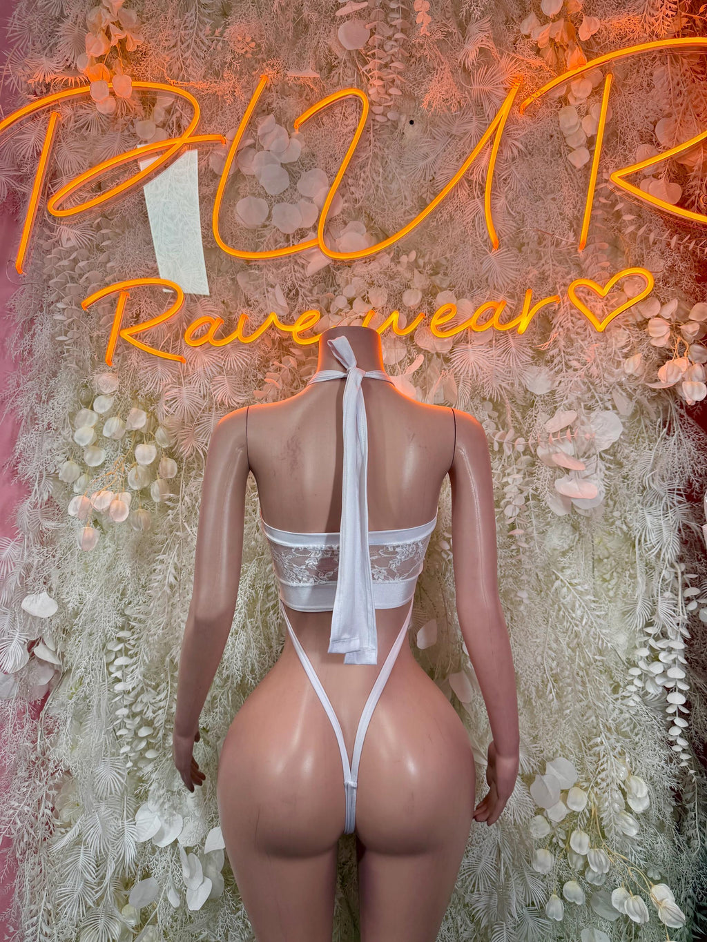 White mesh bodysuit with open back and vertical strap cutout