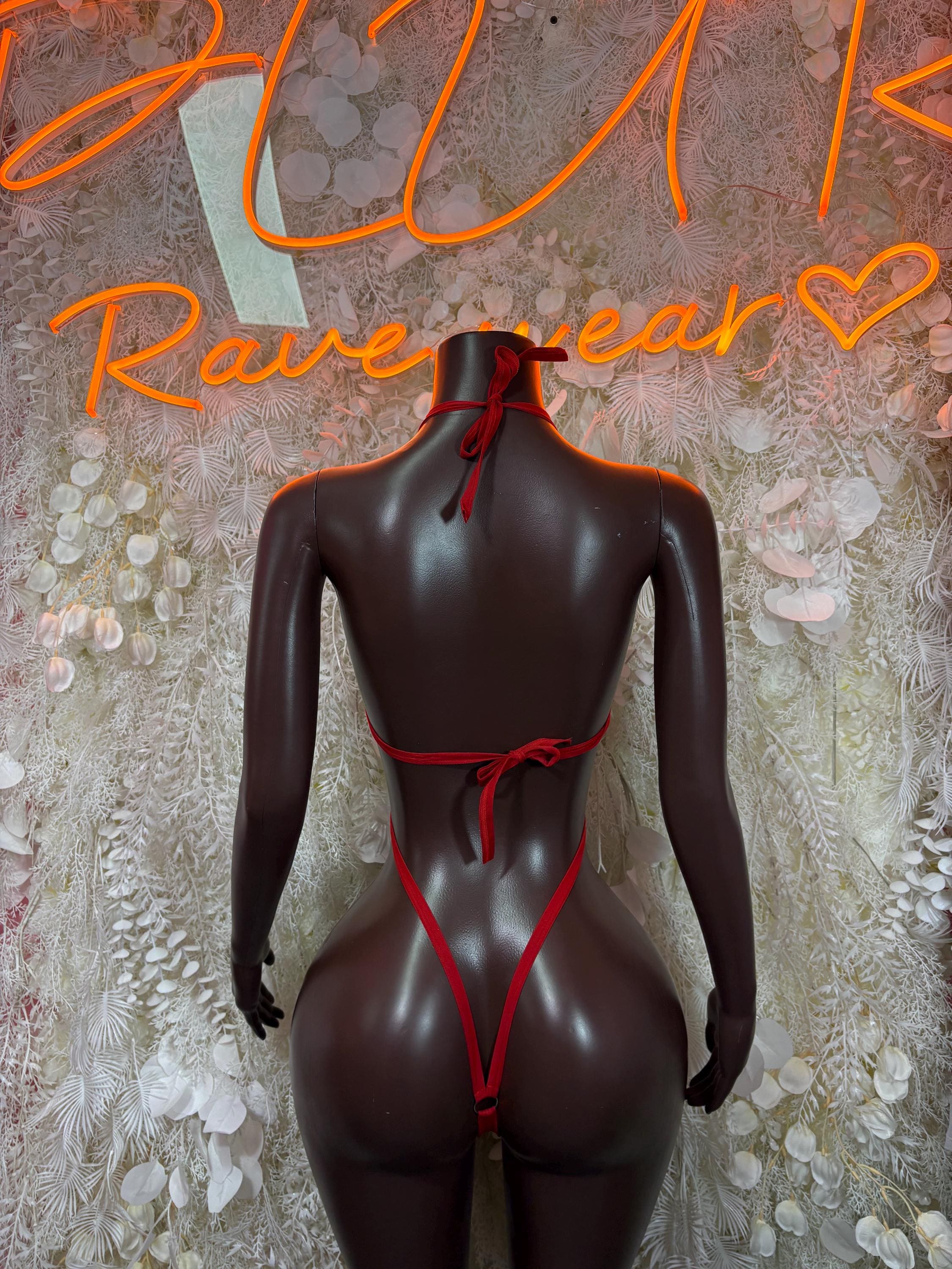 Black bodysuit with red back straps and lace-up cutout