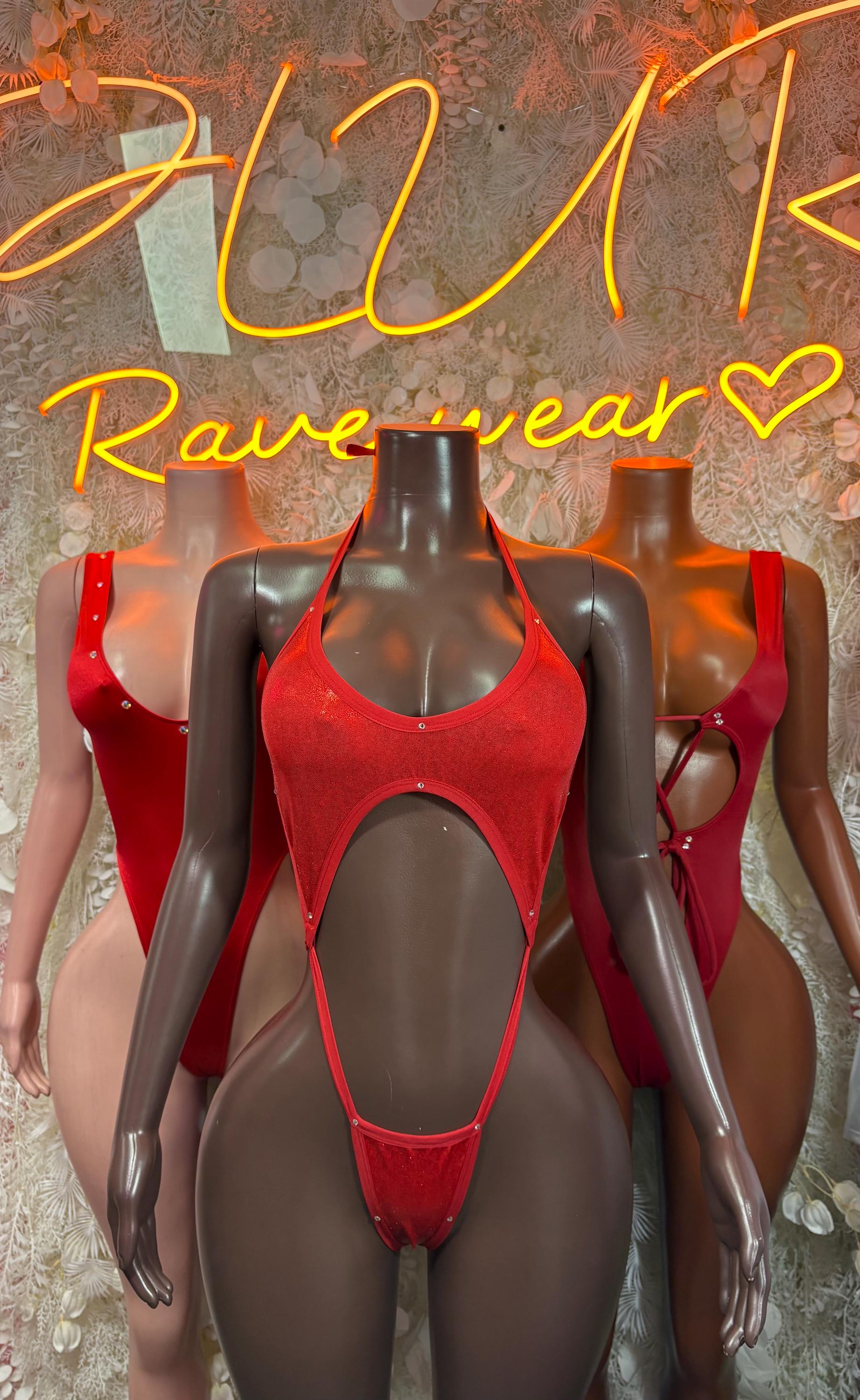 Red one-piece bodysuit with mesh-like cutouts and halter-style straps