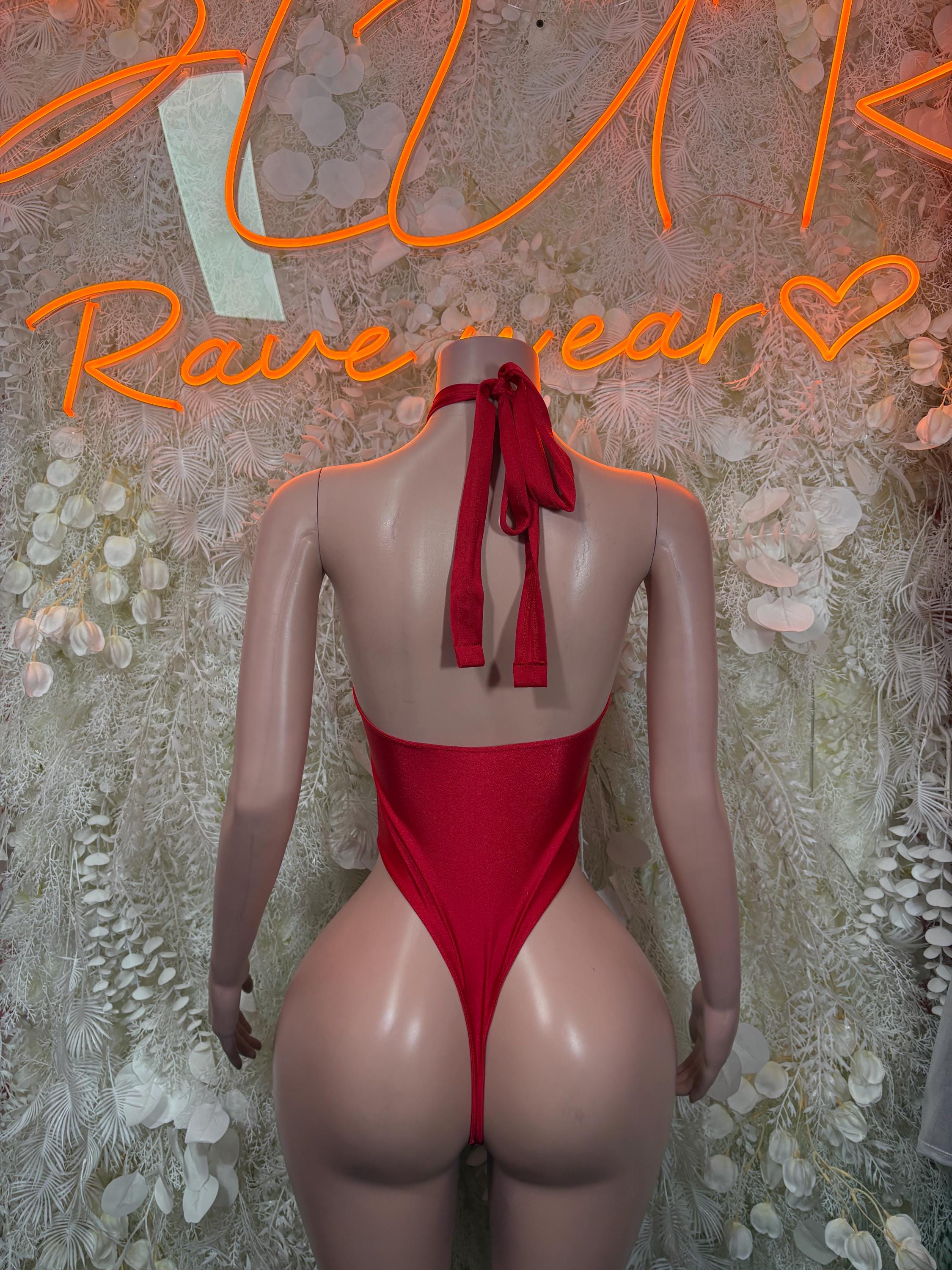 Red backless bodysuit with neck halter and tie bow at center back