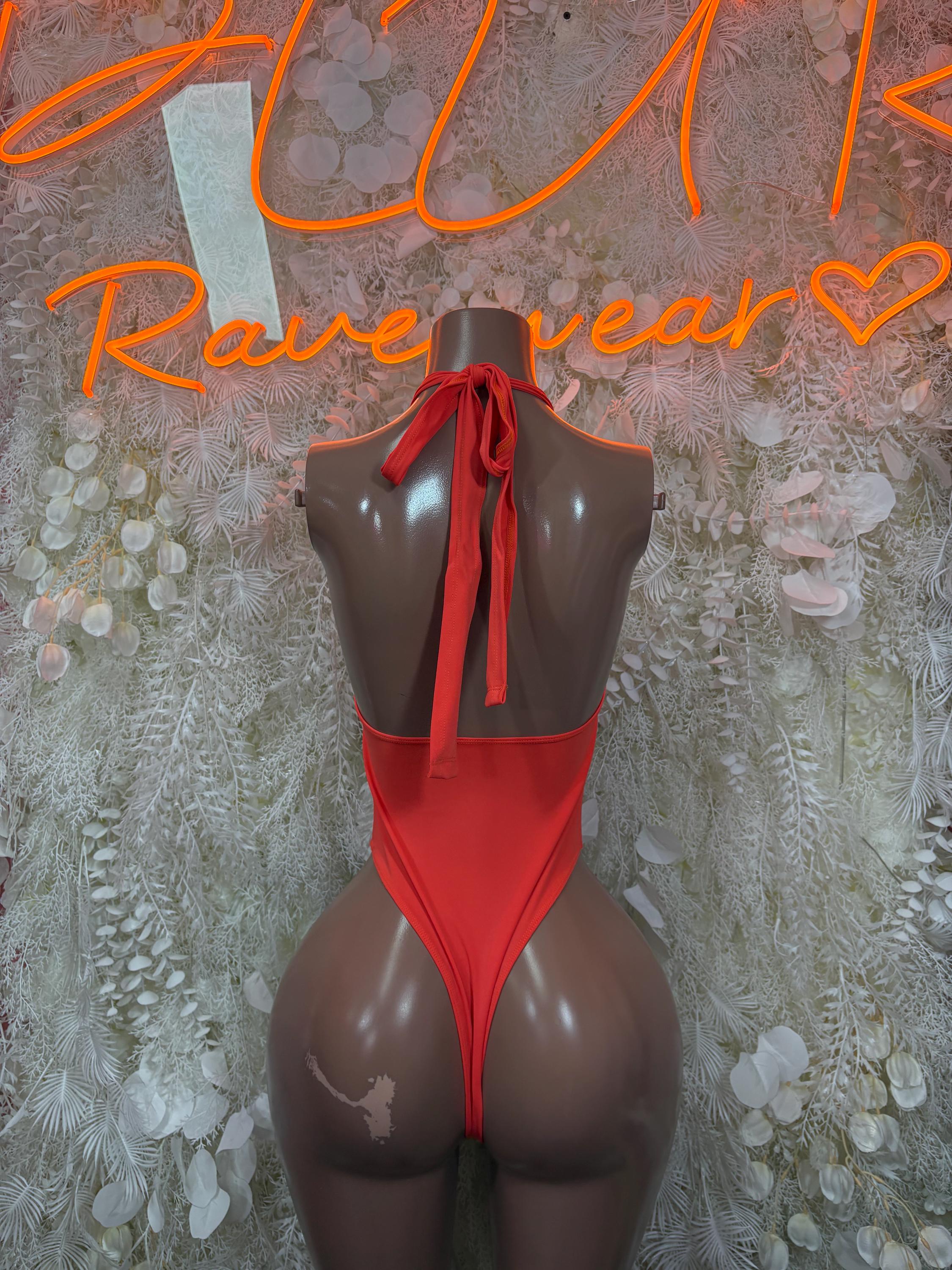 Orange one-piece bodysuit with open back and tie at neckline