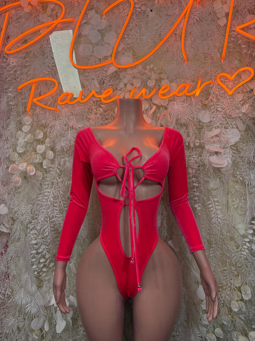 Pink velvet one-piece bodysuit with long sleeves and lace-up front
