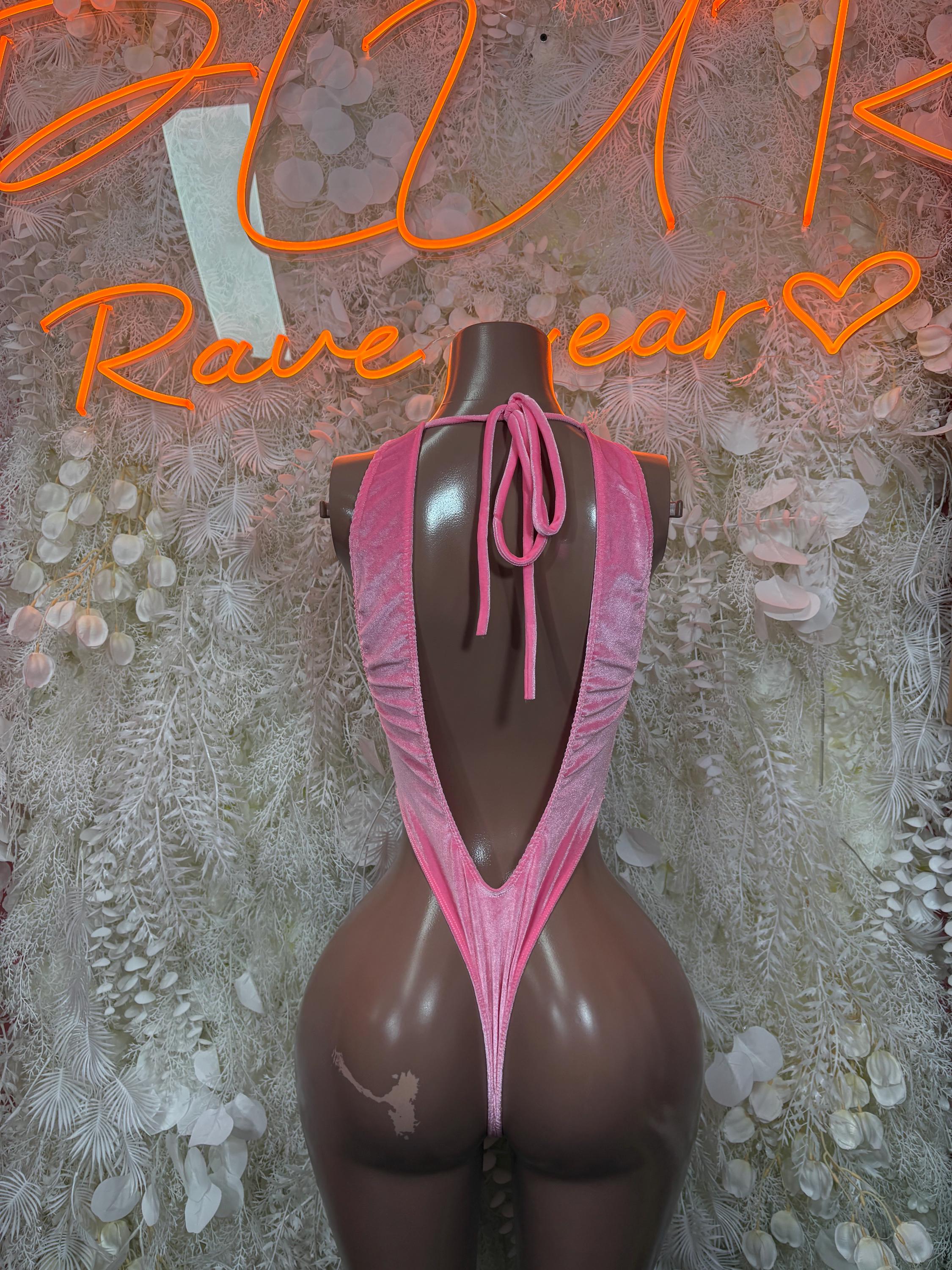 Pink velvet one-piece bodysuit with lace-up back and deep V cutout