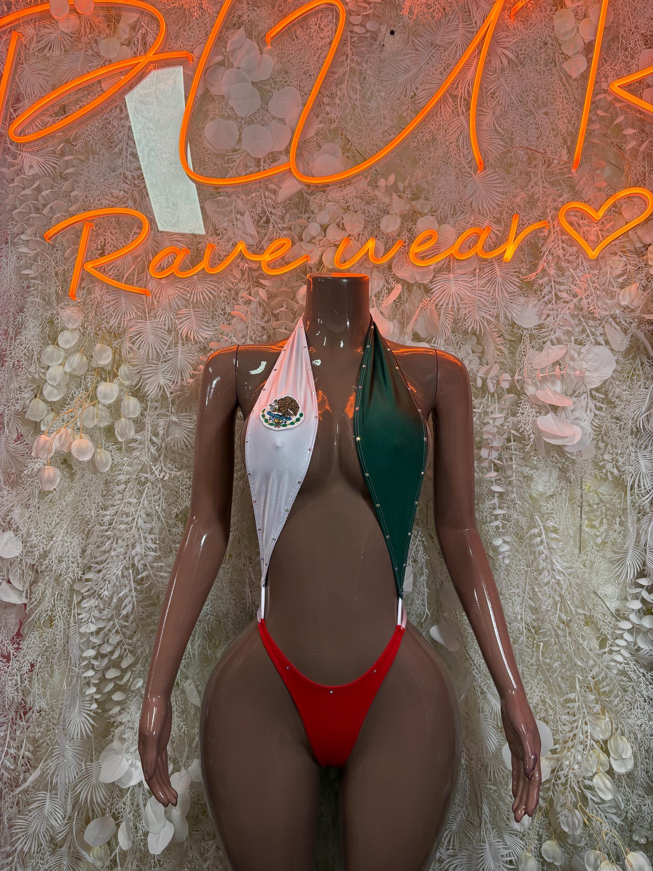 One-piece swimsuit with red center, green side panels, and white decorative neckline trim