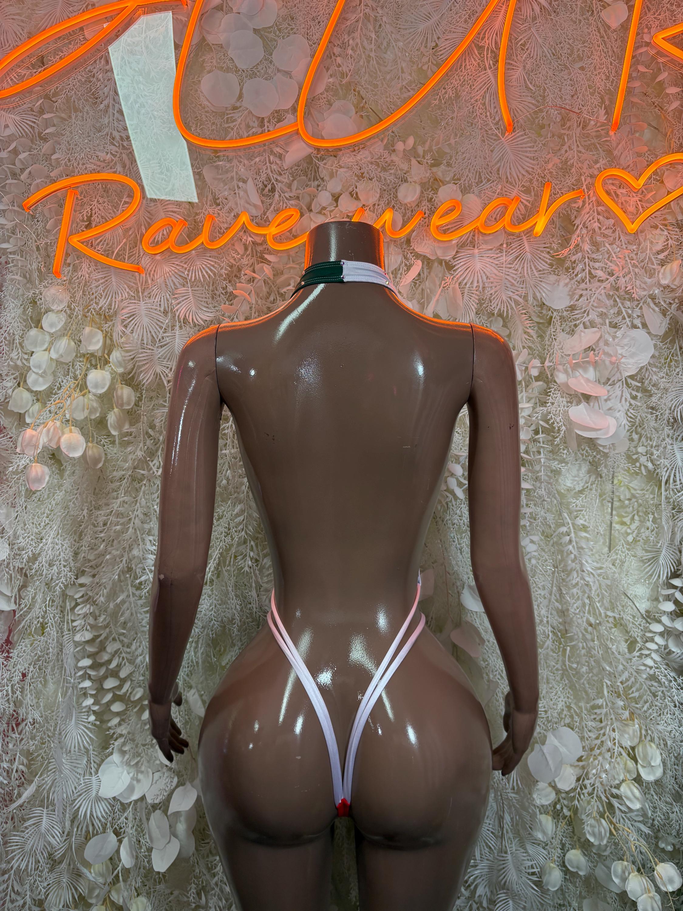 One-piece swimsuit back view with green and red side panels and thin white strap lines
