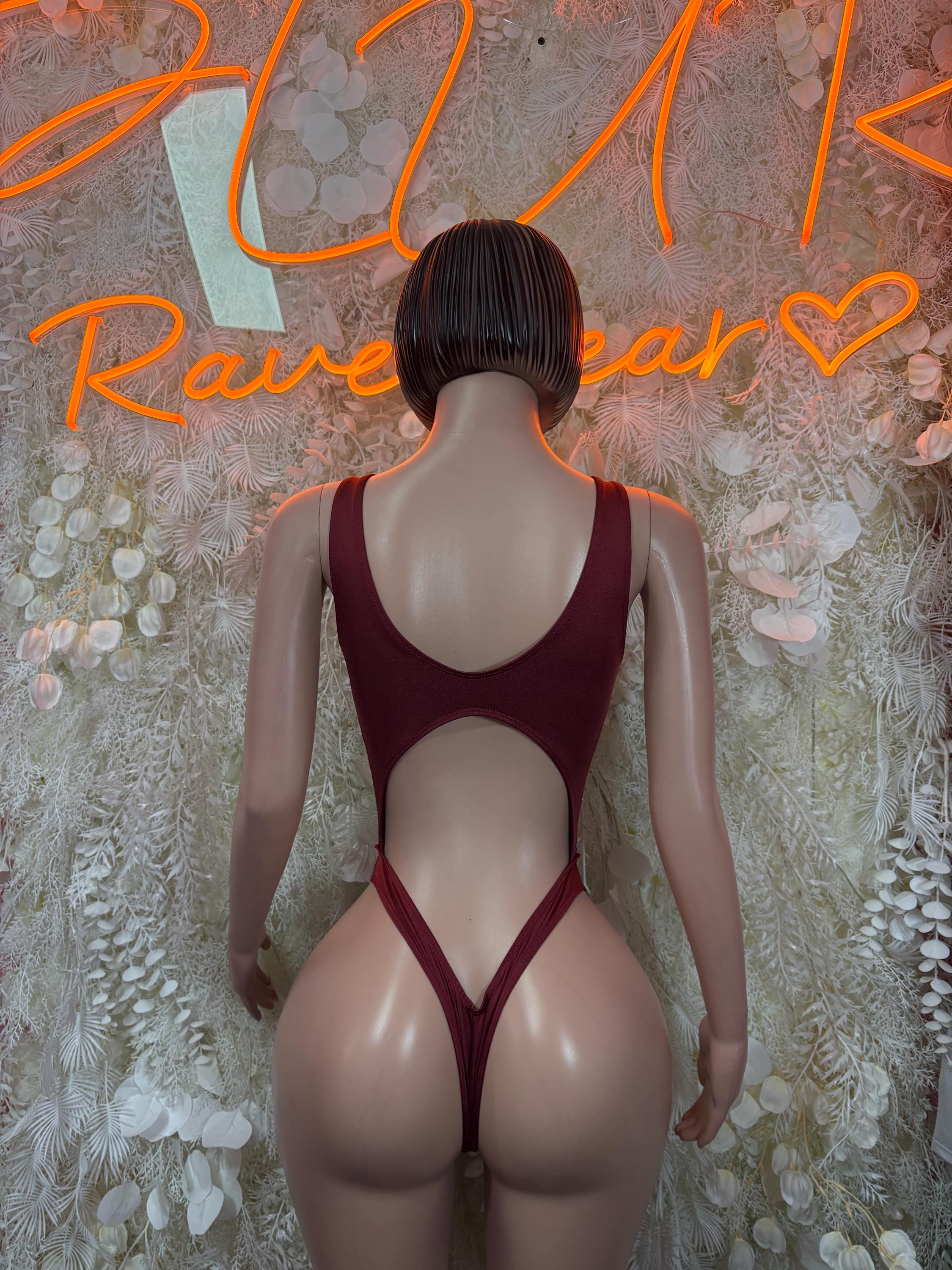 Burgundy strappy bodysuit with open back and high-cut bottom