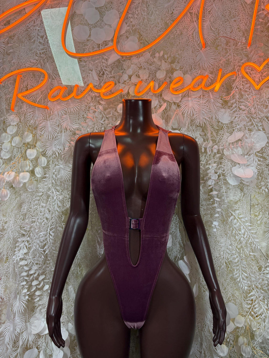 Purple velvet bodysuit with deep V neckline and central zipper detail on front