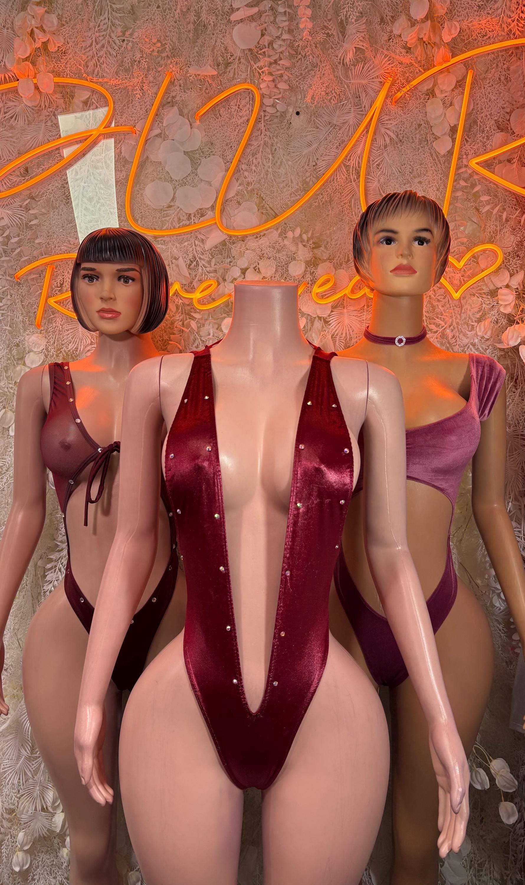 Purple velvet bodysuit with deep V front and thin straps, halter style