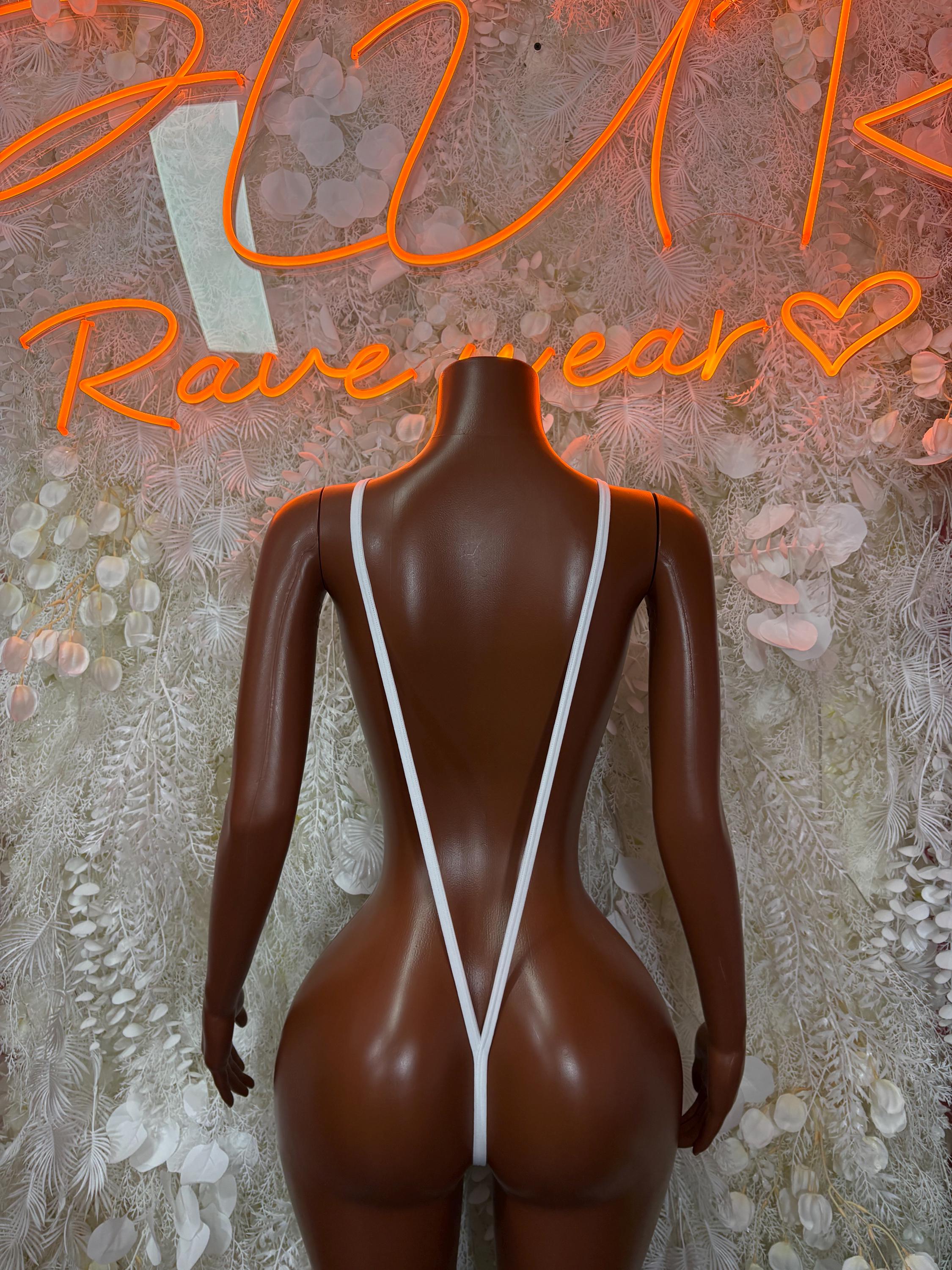 White fishnet one-piece with crisscross back straps and open-back V silhouette