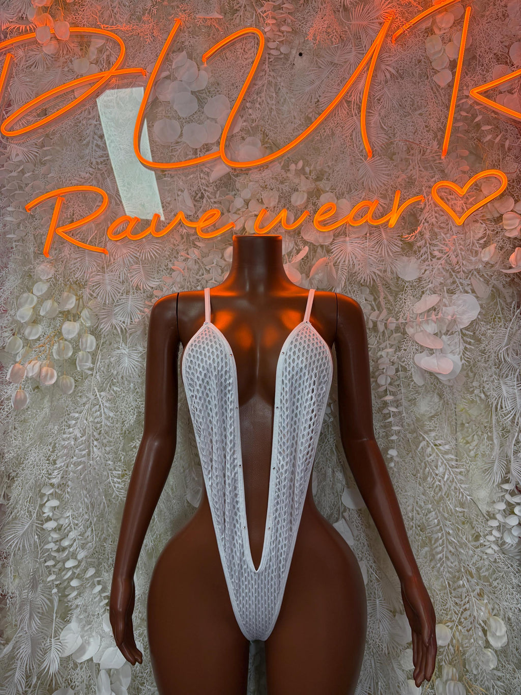 White fishnet one-piece with deep V back straps and halter neckline