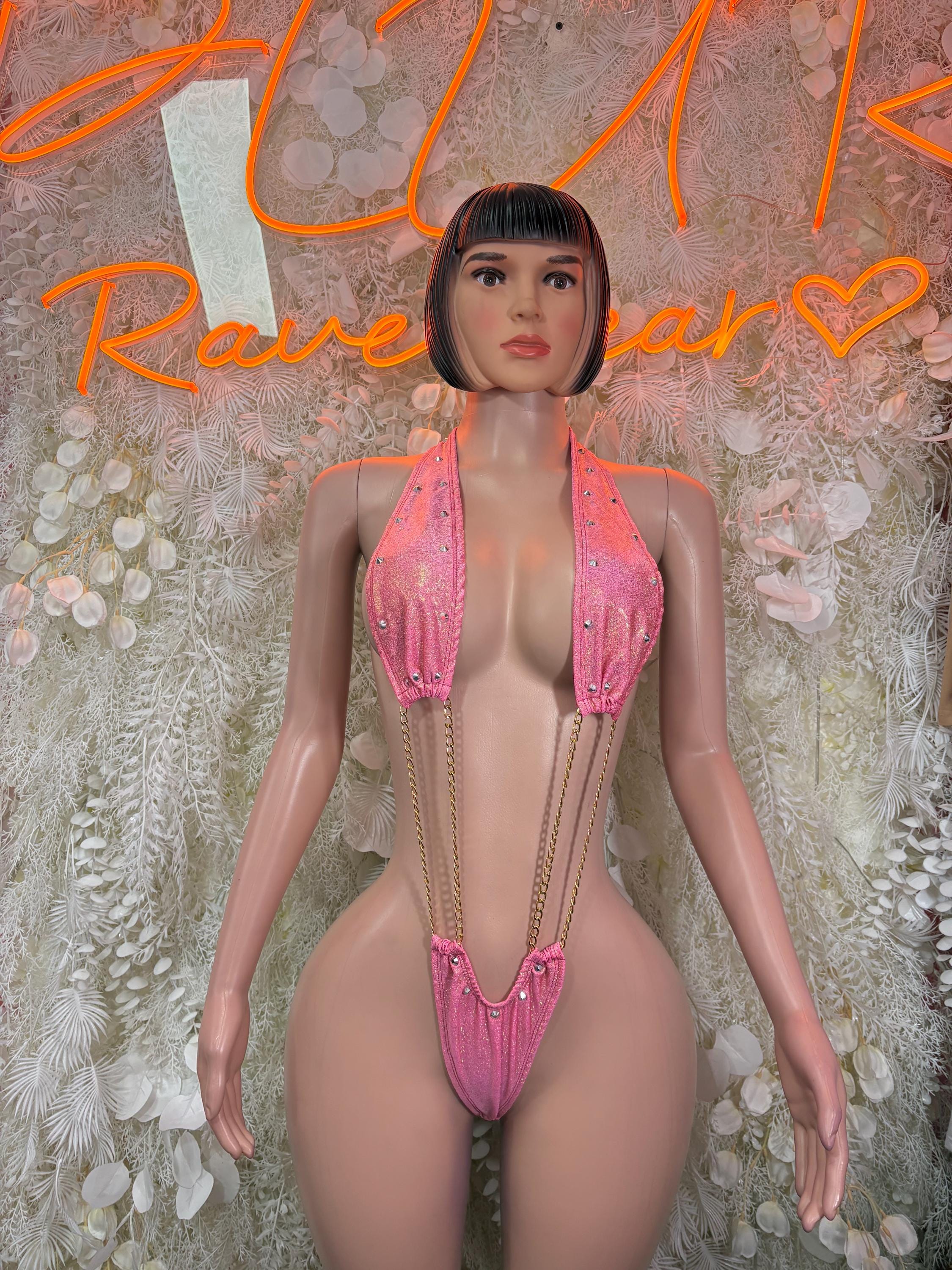 Pink halter one-piece bodysuit with chain straps and glitter cups