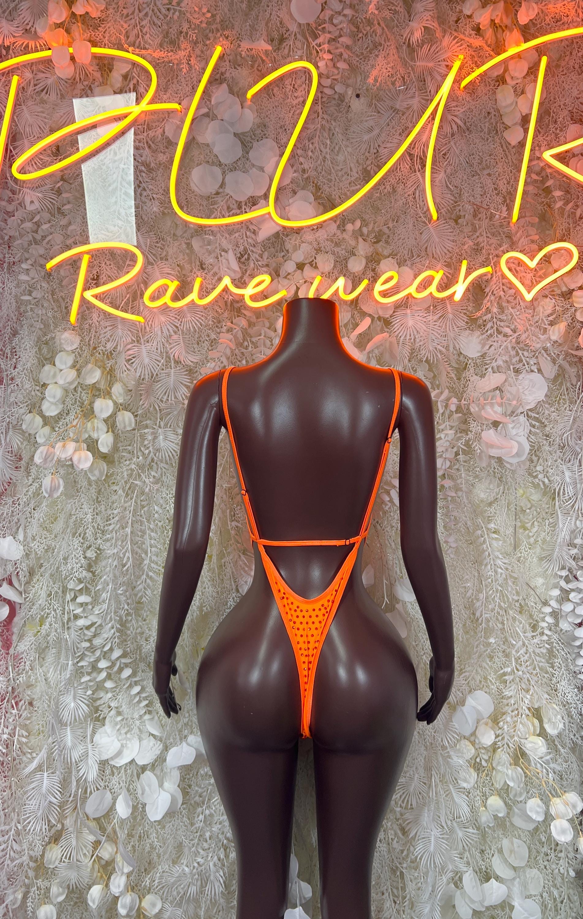 Back view of orange rhinestone bodysuit with thin straps