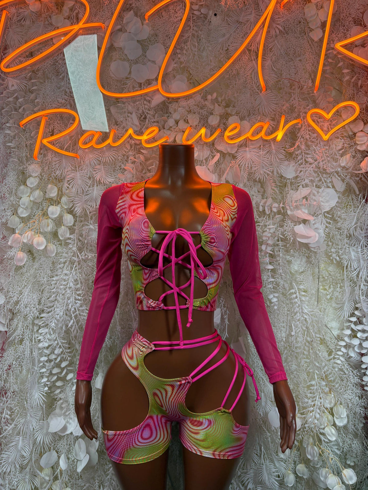 Pink metallic hologram dancewear set with lace-up long-sleeve top and cutout shorts