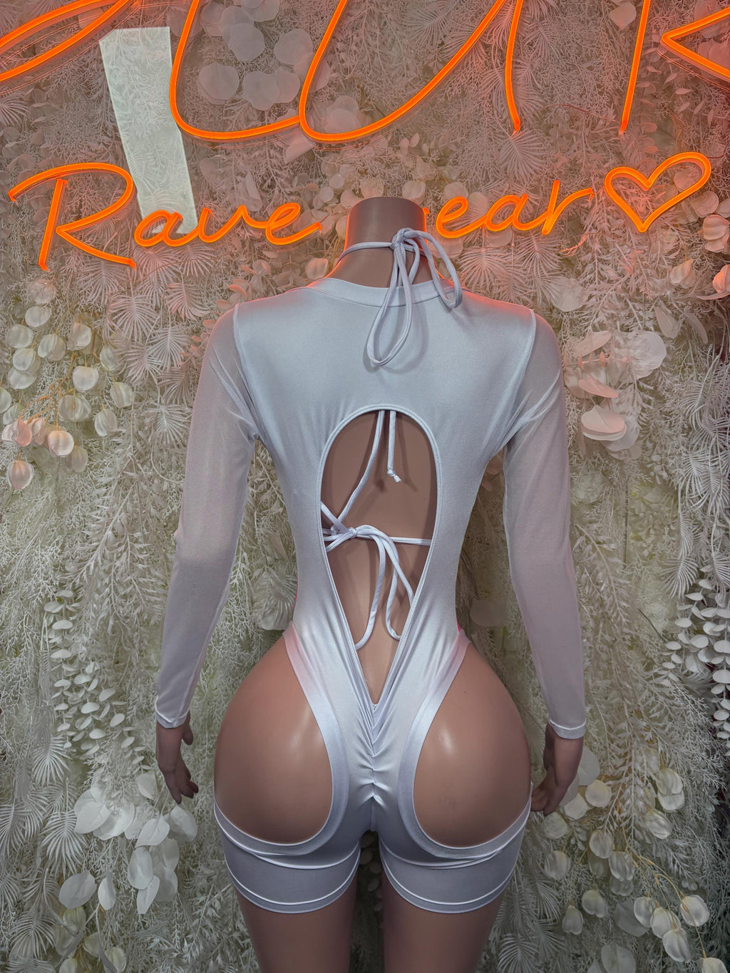Rainbow hologram bodysuit back with open V-shape, lace-up straps, and sheer long sleeves