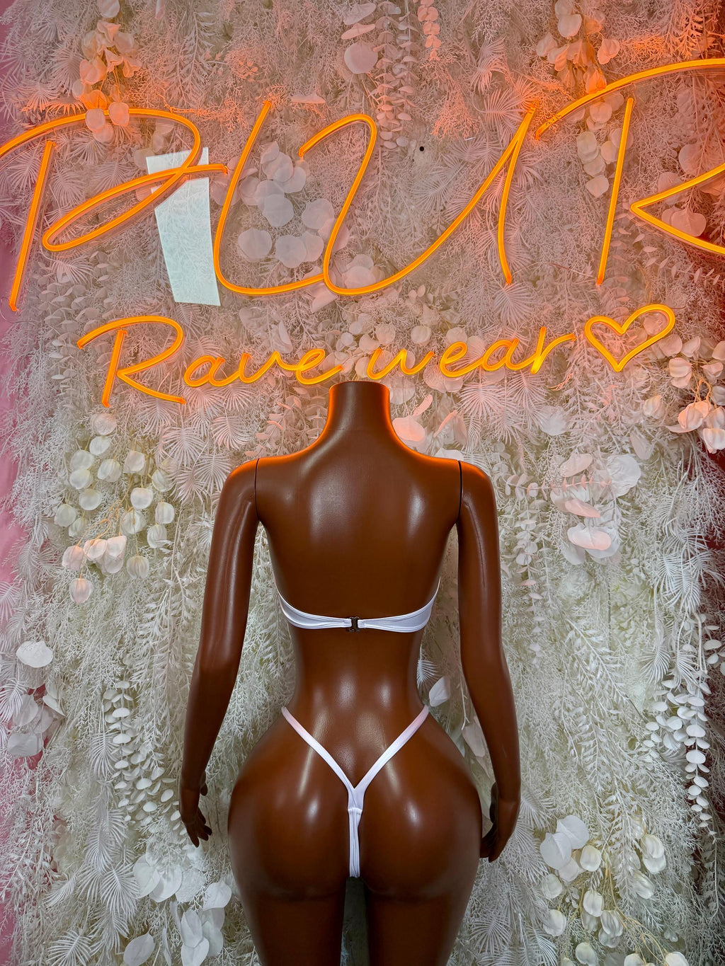 White bikini set with bandeau top and high-cut bottoms, back view