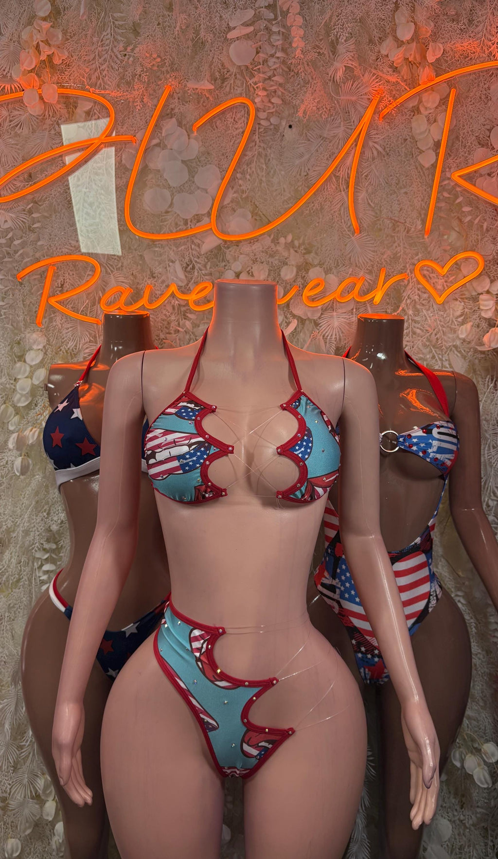 Two-piece bikini with scalloped star-and-stripe trim, teal red and blue, front view