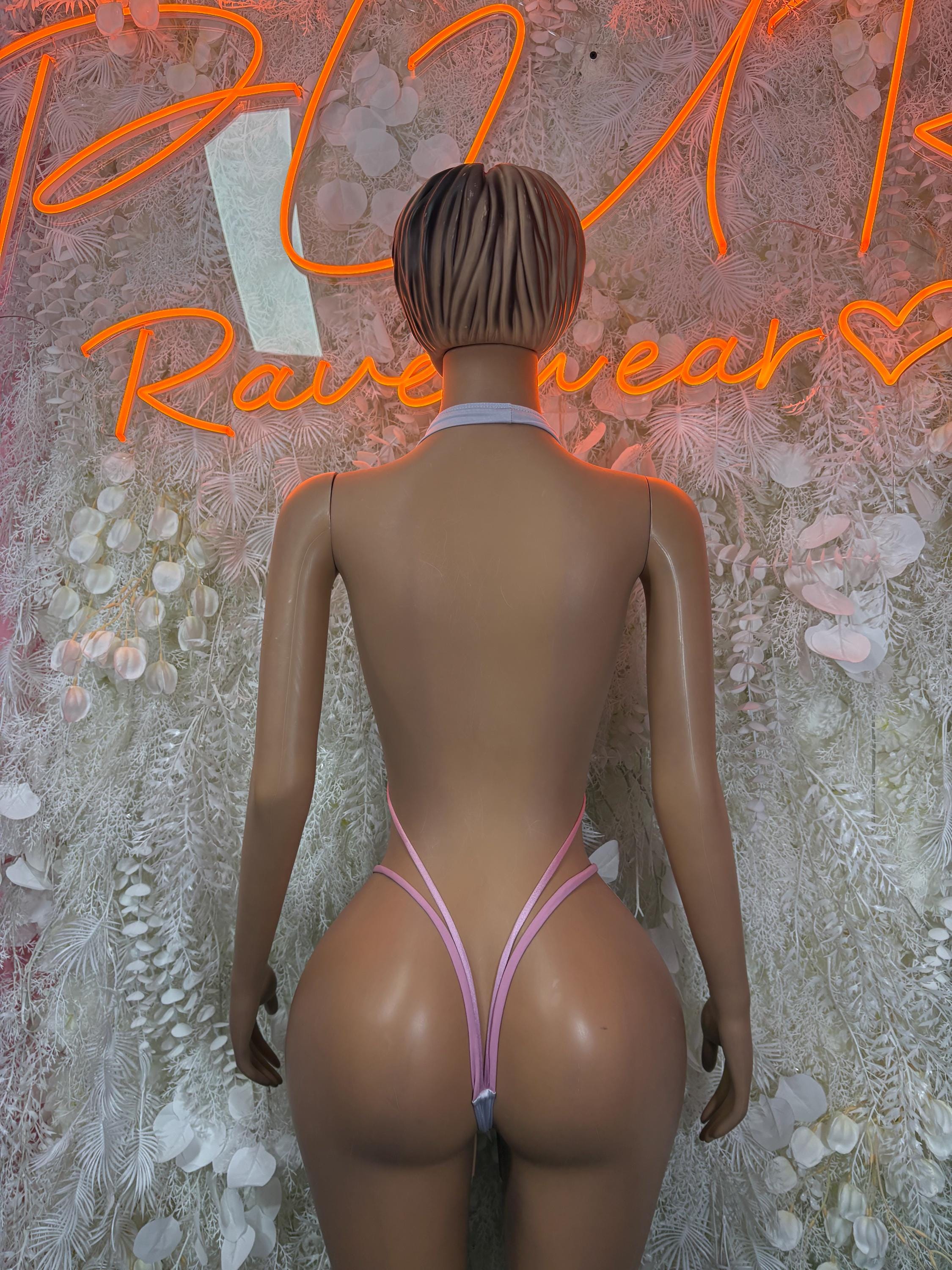 White and pink slingshot bodysuit, back view with thin strap and tie accents