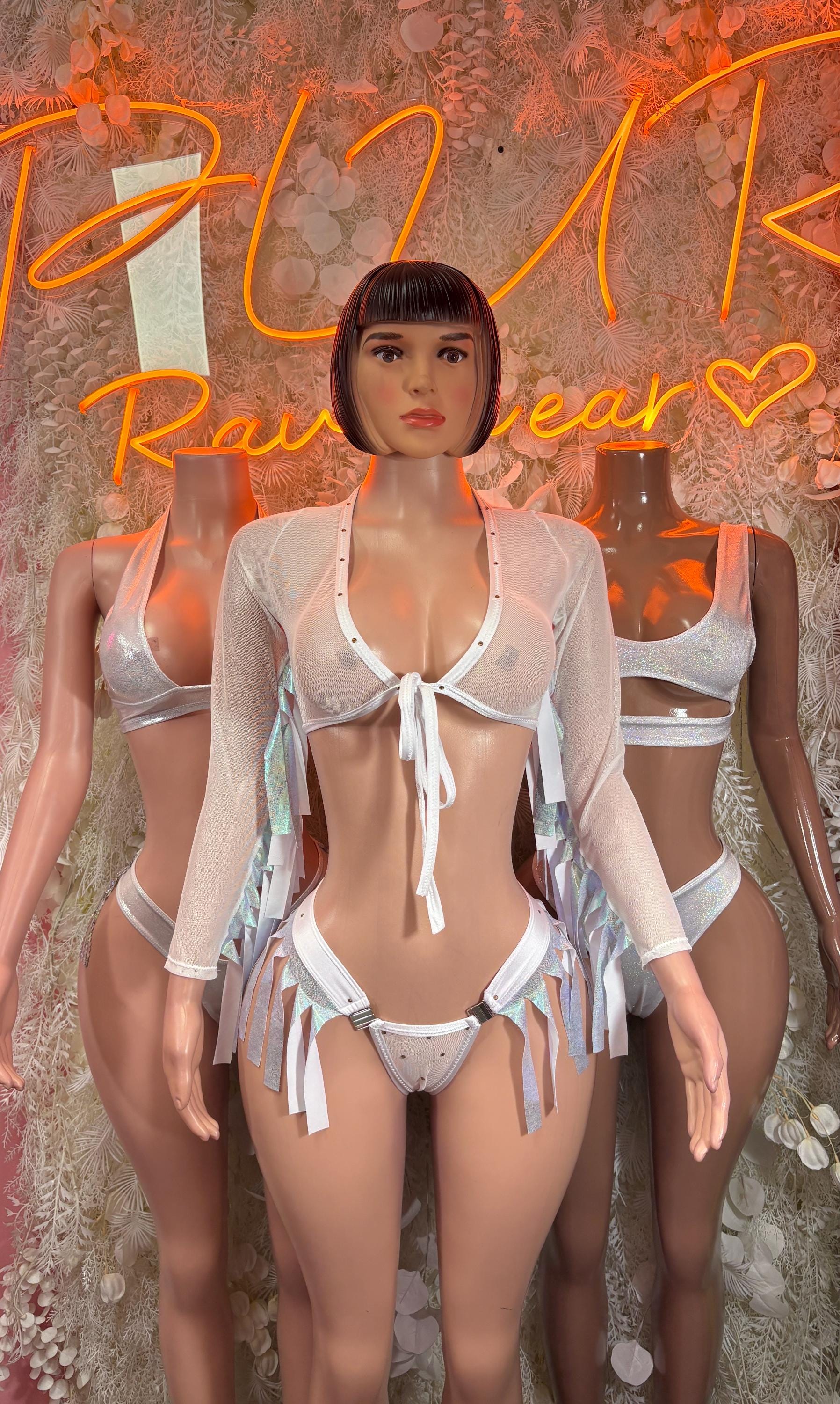 White metallic bikini set with bow-tie top, high-cut bottoms, and sheer arm sleeves
