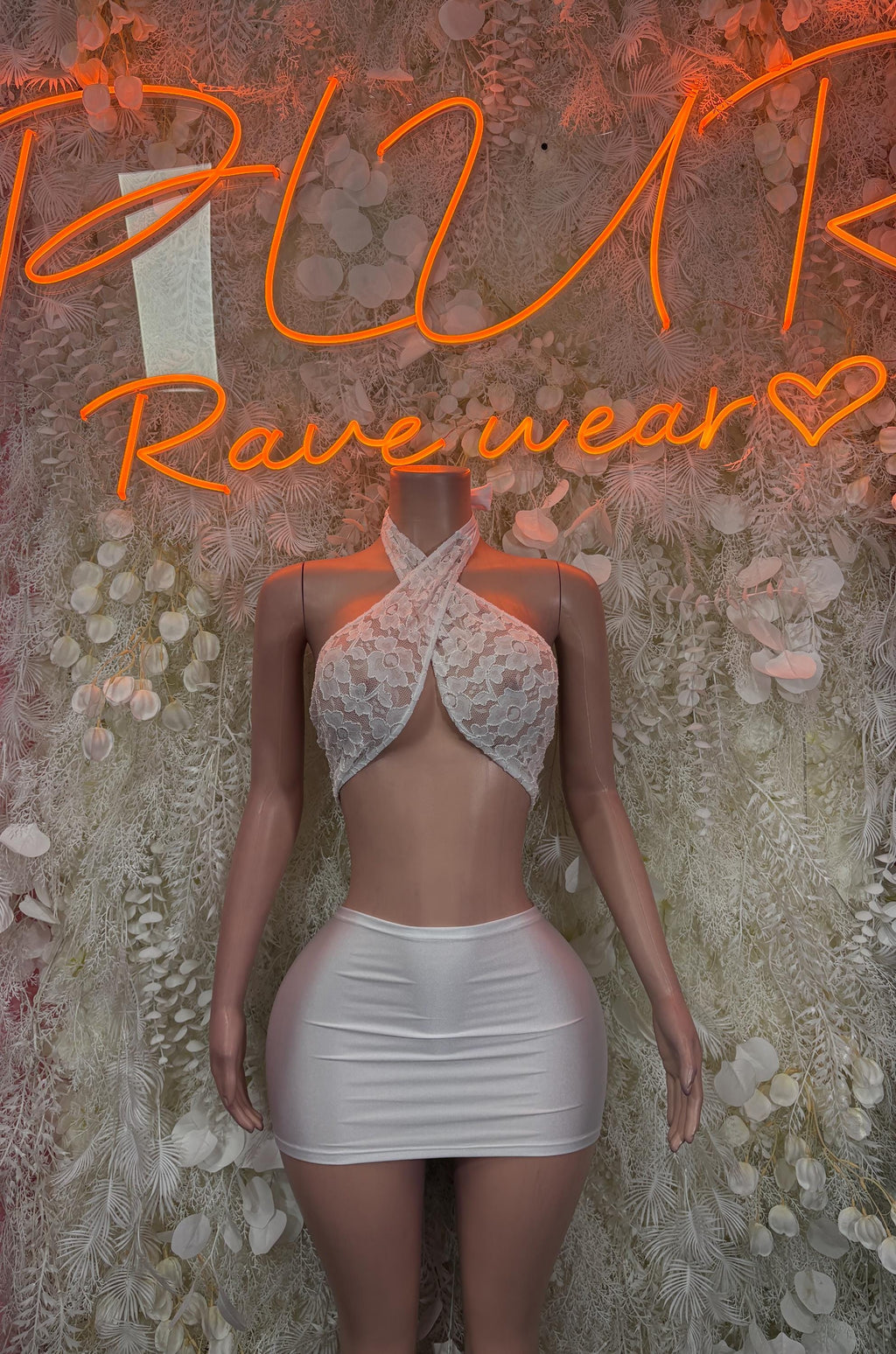 White lace halter mini dress with ruched skirt and backless tie detail