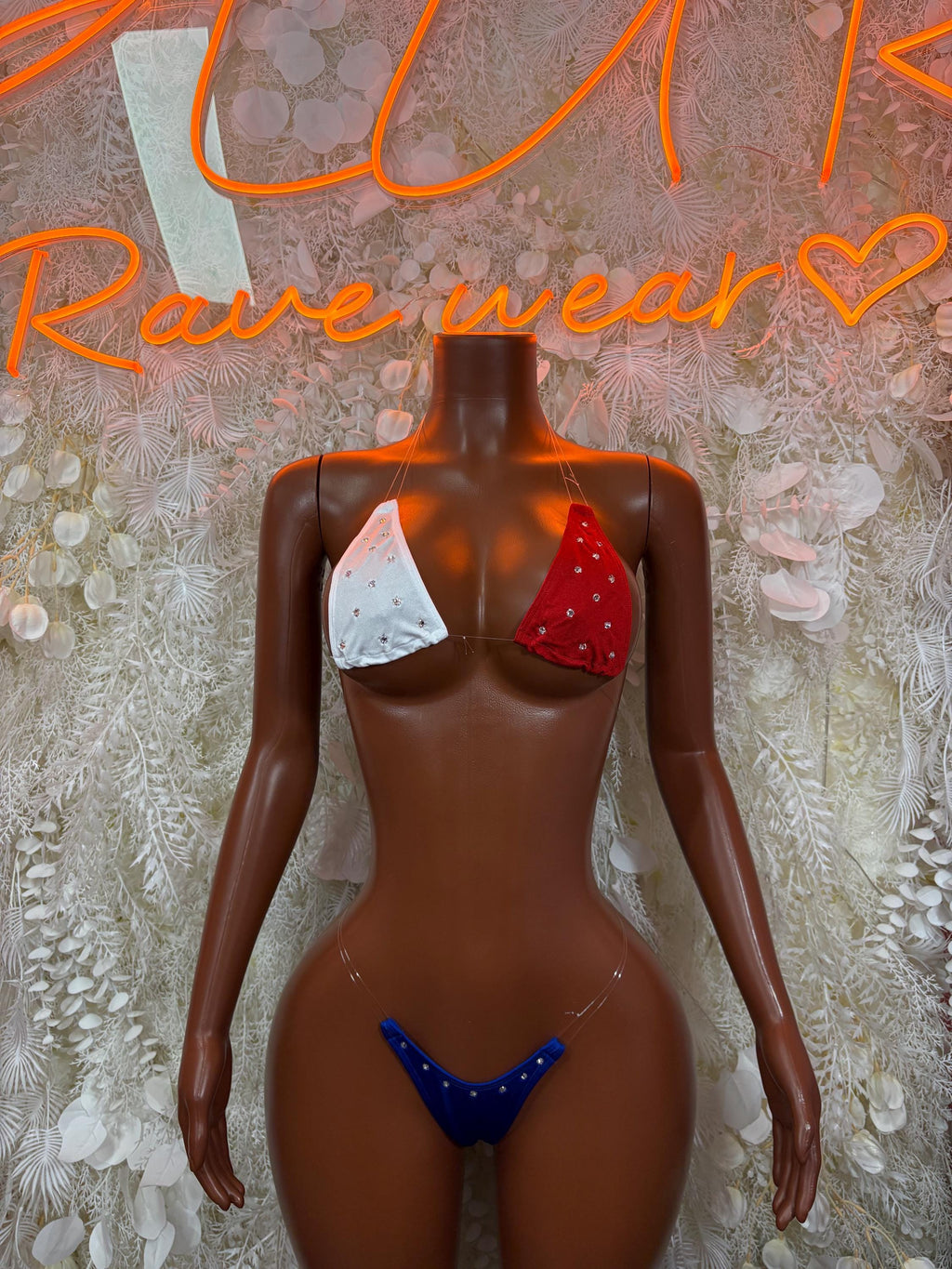 Patriotic star-and-stripe two-piece bikini with red, white, blue top and blue bottoms
