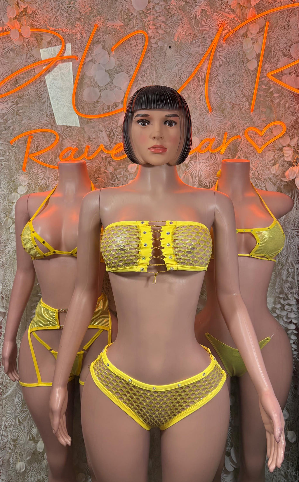 Yellow textured two-piece rave outfit with bandeau-style top and high-cut bottoms