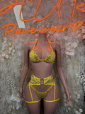 Yellow strappy two-piece rave outfit with triangle bra and matching high-rise bottoms