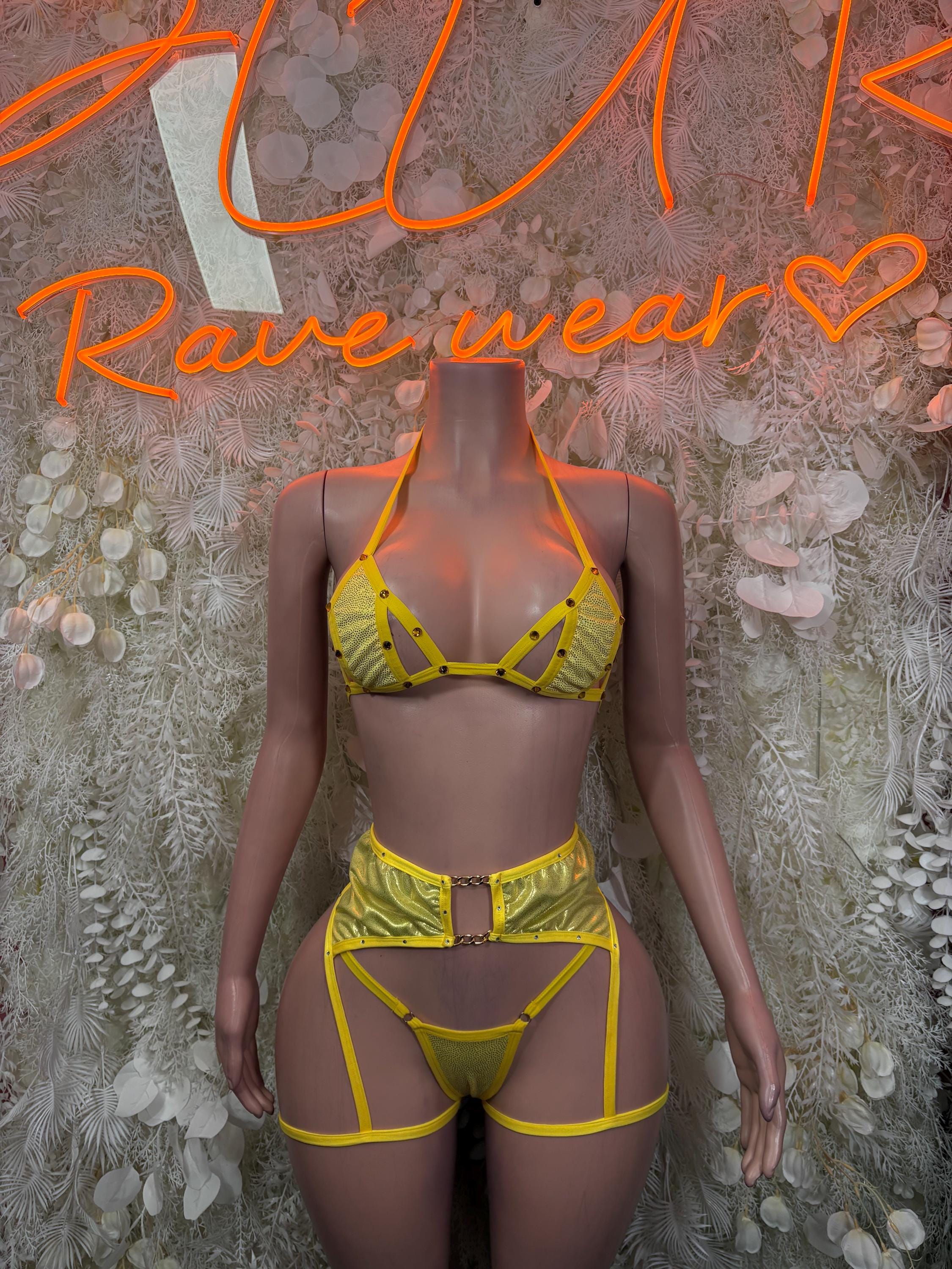 Yellow strappy two-piece rave outfit with triangle bra and matching high-rise bottoms