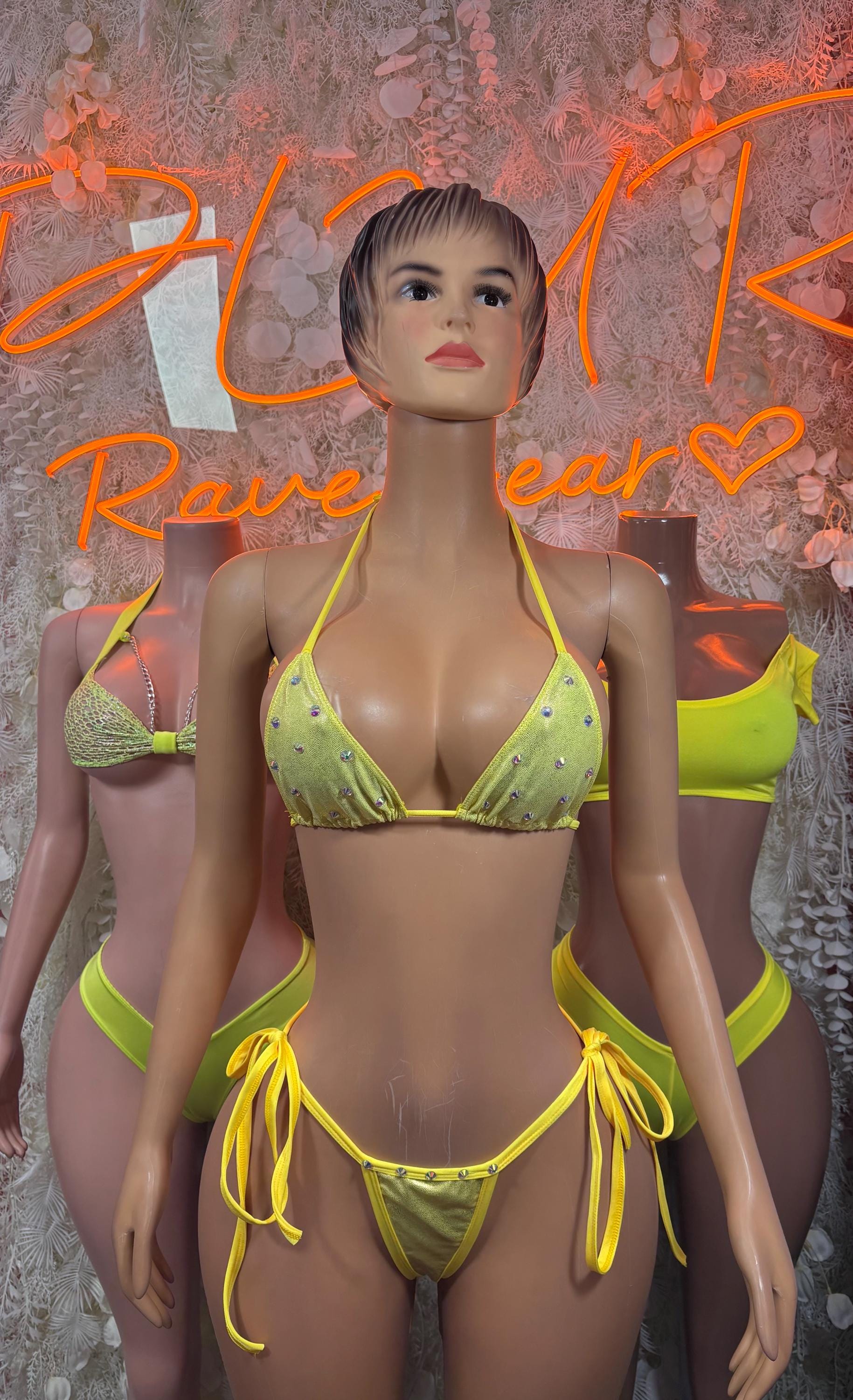 Lime yellow tie-triangle bikini top and high-cut rave bottoms, model wearing