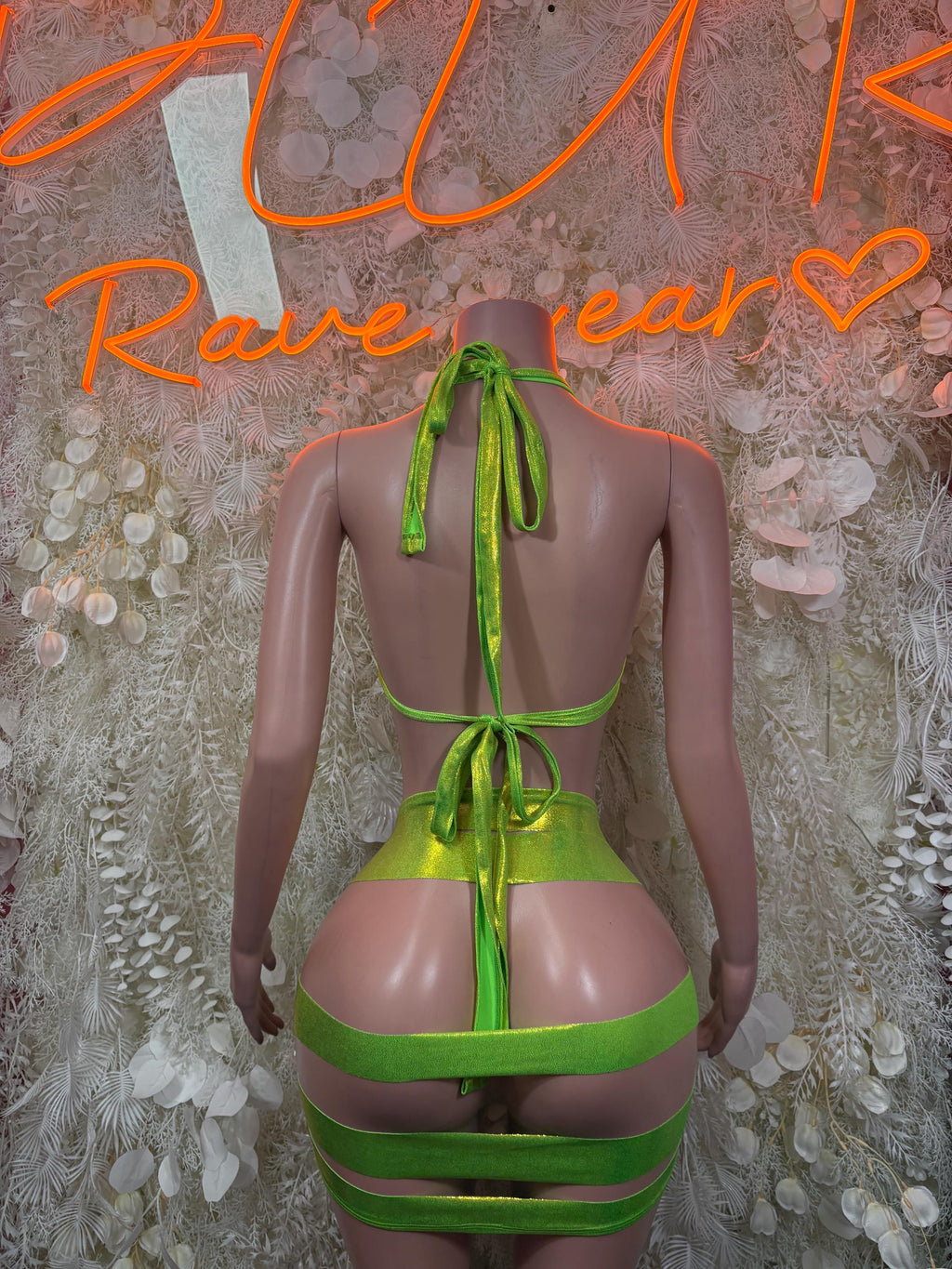 Green metallic two-piece ravewear set with strappy backless triangle top and short shorts