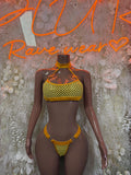 Yellow fishnet two-piece set: halter bra and high-cut bottoms, orange trim