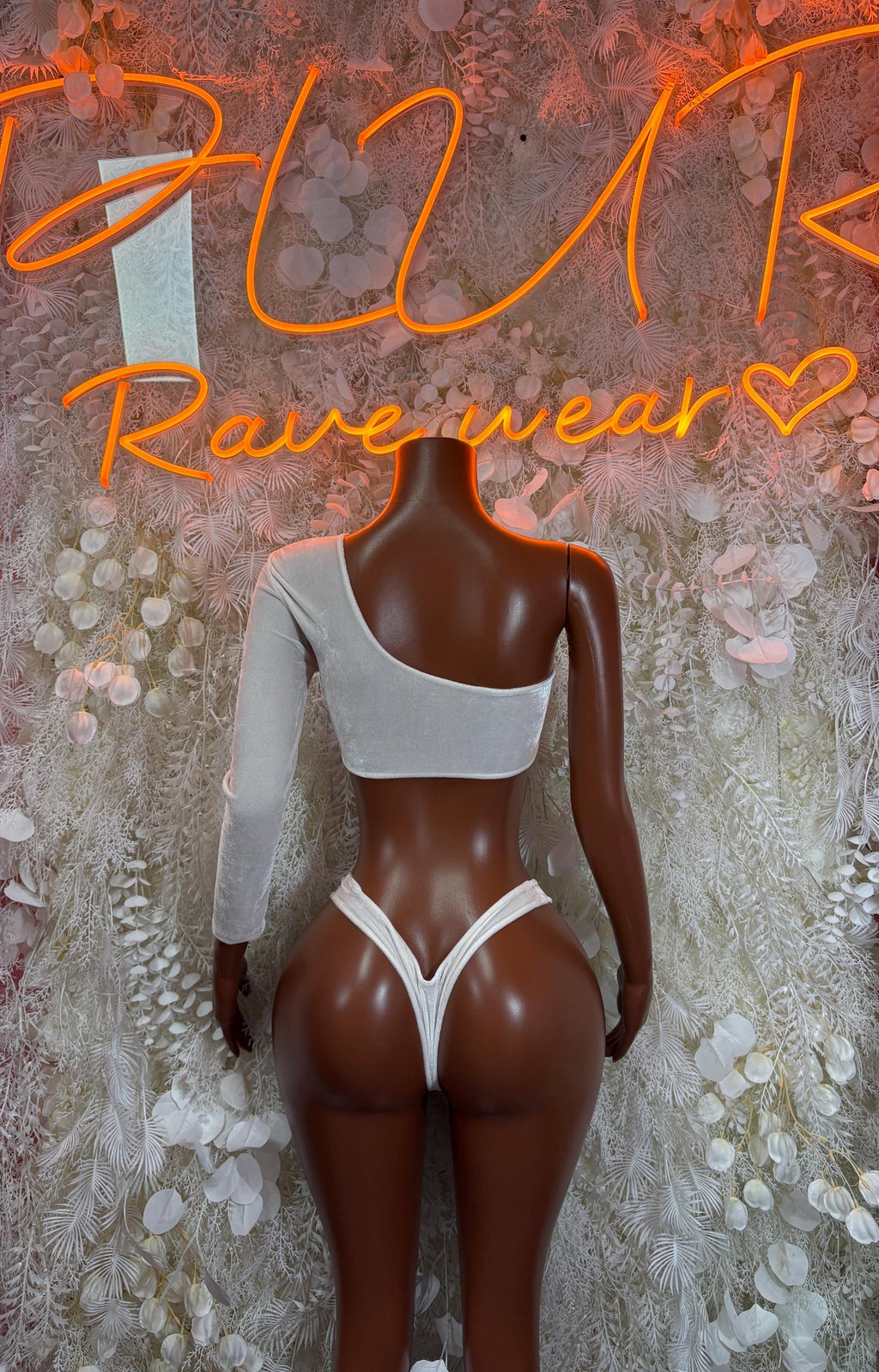 White backless bikini top and high-cut bottoms with thin straps