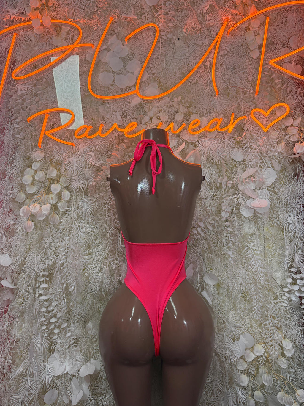 Coral halter bodysuit with tied neck straps and open back