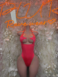 Coral pink dance bodysuit with cutout chest and cheeky high-leg front.