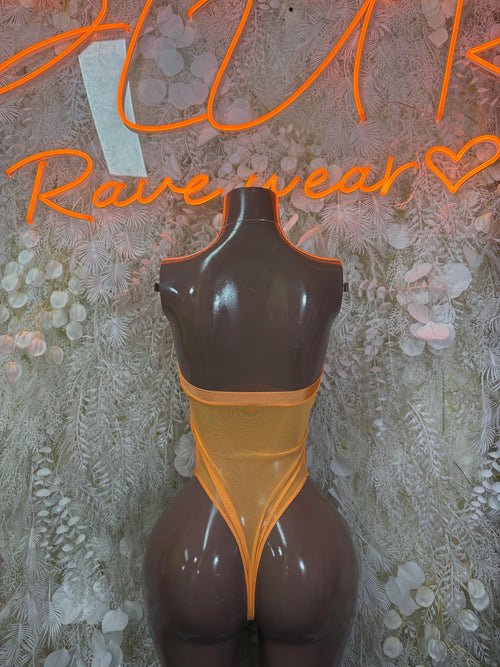 Orange one-piece bodysuit with open back and black sheer lower panels