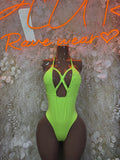 Neon green cutout bodysuit with strappy neckline and high-cut legs.