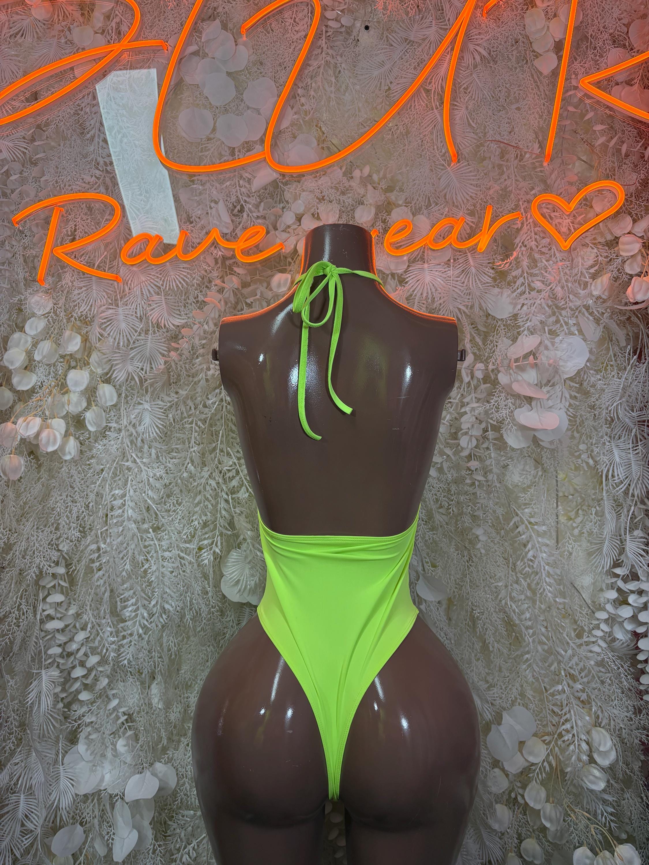 Neon green cutout bodysuit with halter back straps and high-cut legs.