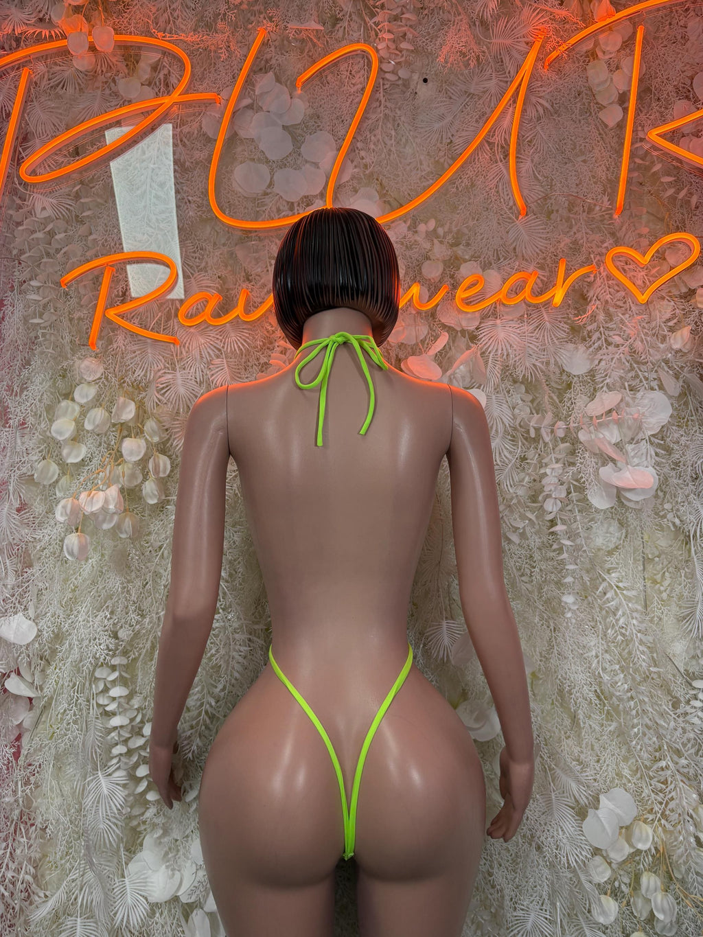 Neon green fishnet one-piece bodysuit, open back with tied string detail