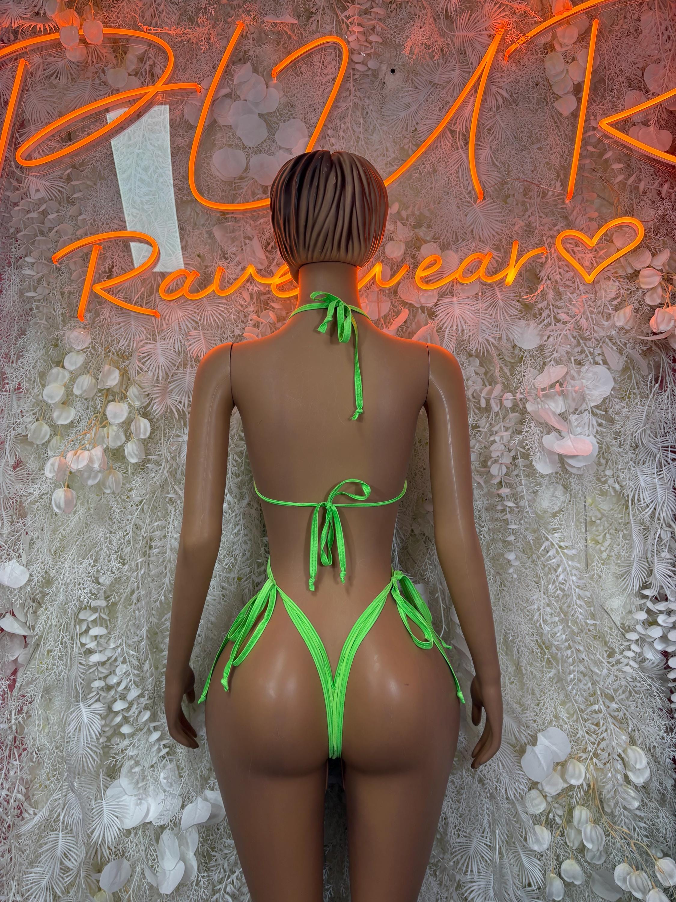 Neon green mesh bodysuit back view with tie strings and high-leg cut